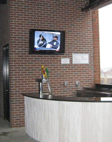 tv mounted in brick 
