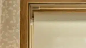 Close-up of a Palladiom exposed roller shade bracket and fabric