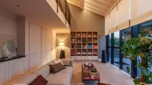Contemporary open-plan living room with warm architectural lighting